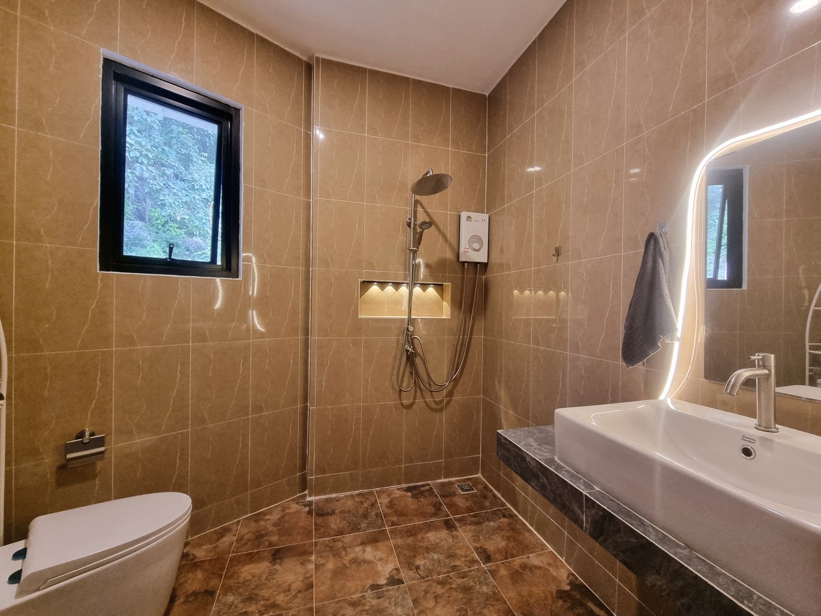 Modern tiled bathroom with rain shower