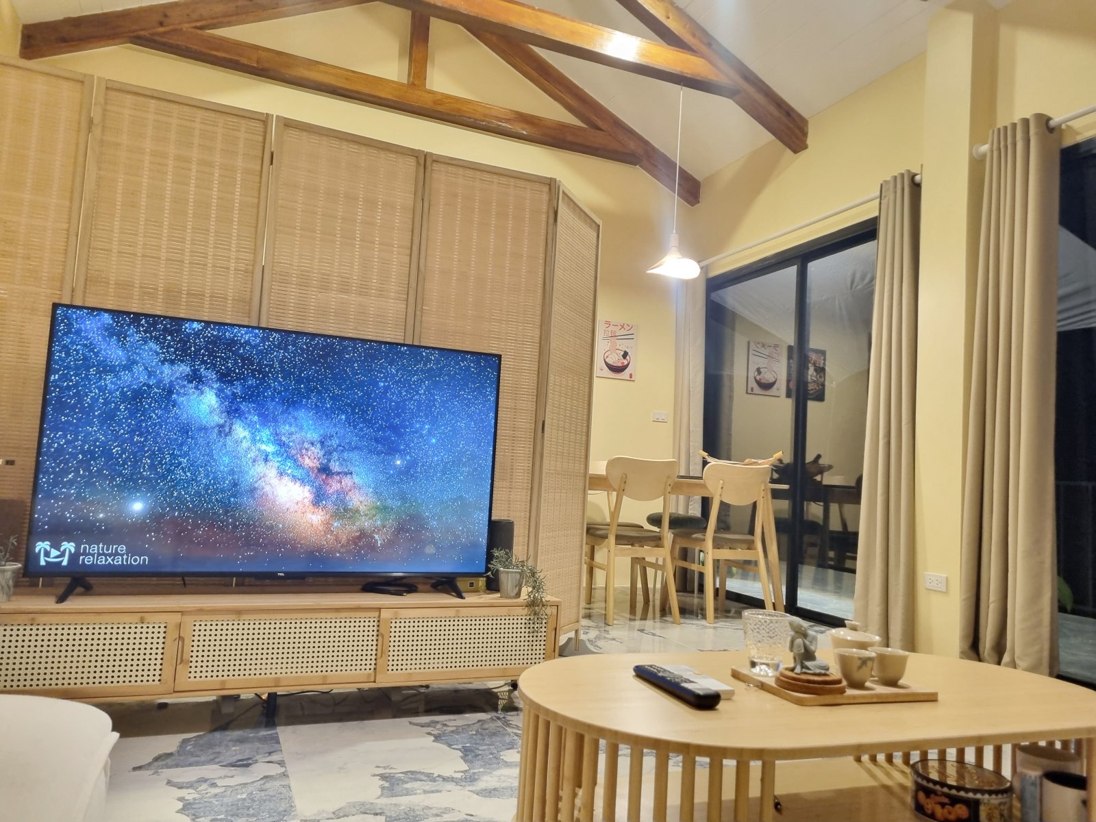 Cathedral-beamed living room at night